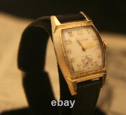 Rare vintage 1951 Bulova Swiss 7 jewel men's fancy case gold wristwatch, running